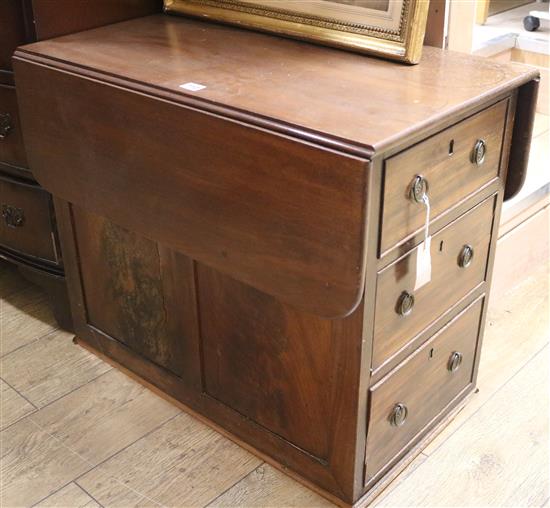 A mahogany chest fitted three drawers with a drop flap top, W.71cm